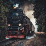 Train with rolling smoke on tracks