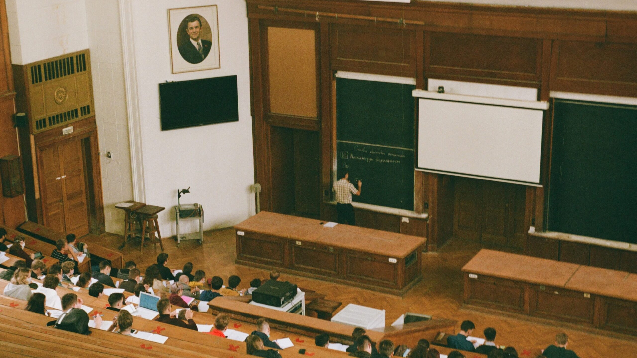 Students attending a lecture in a university classroom