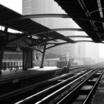 Black and white image of a train platform