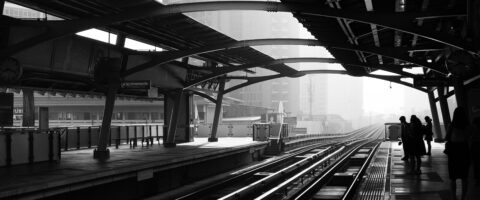 Black and white image of a train platform