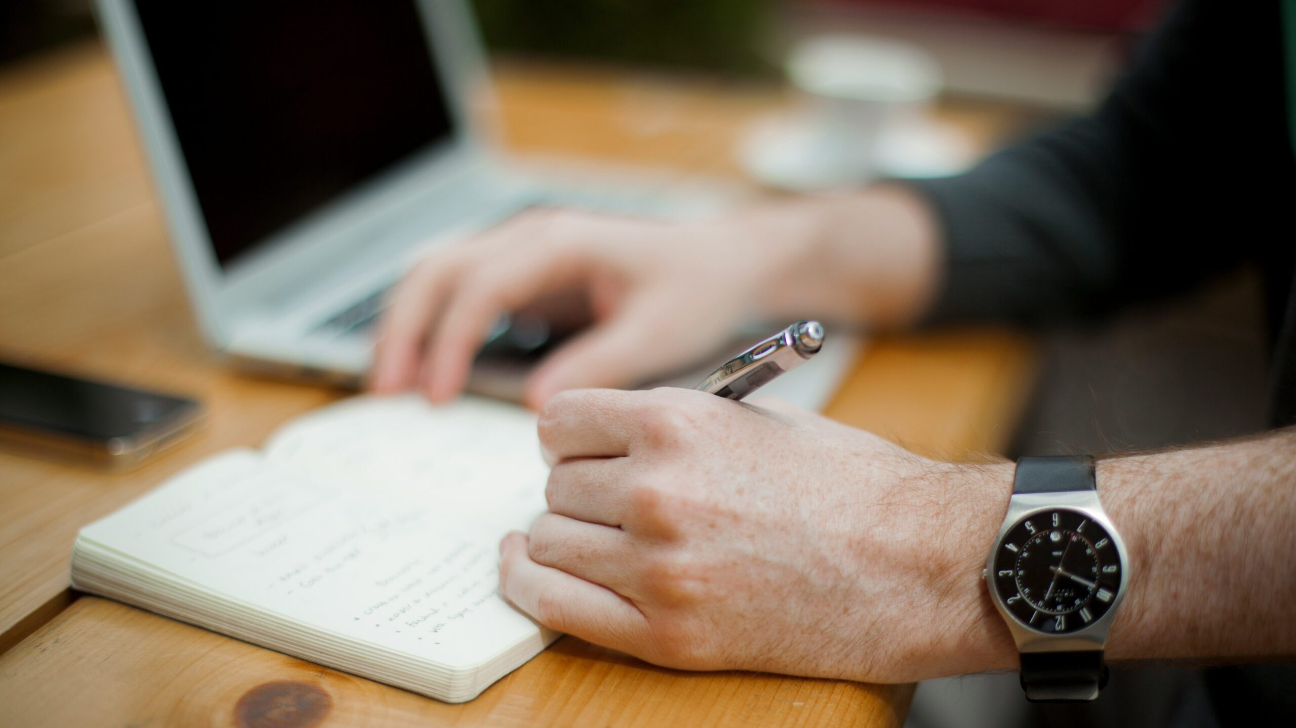 Man writing in a notebook