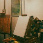 A room filled with paintings, canvas and paintbrushes