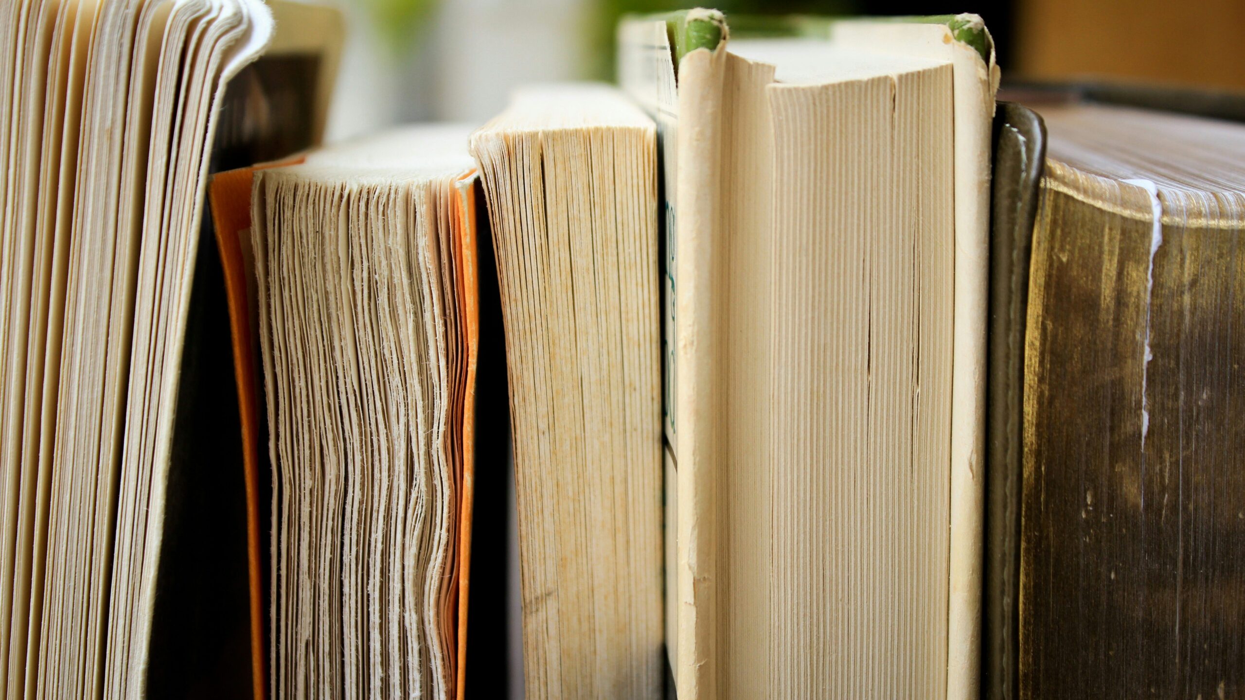 Close-up of the pages of five books