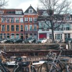 Bicycles parked by a river in a Dutch town