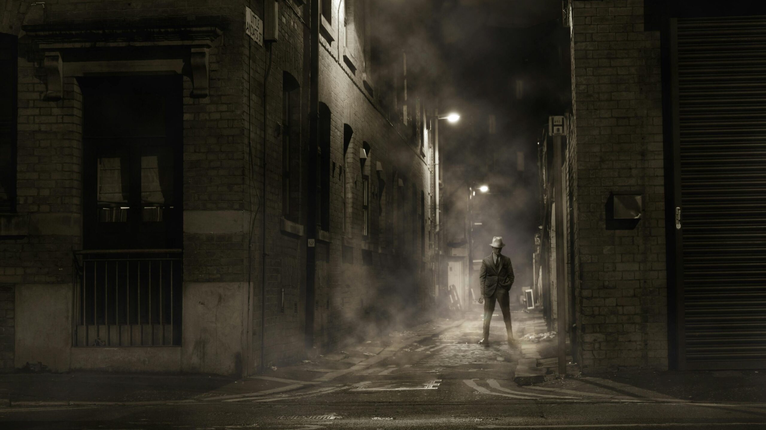 The silhouette of a man in a dark alley.