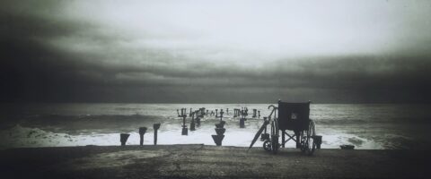 An abandoned wheelchair by the sea. Image by StockSnap from Pixabay