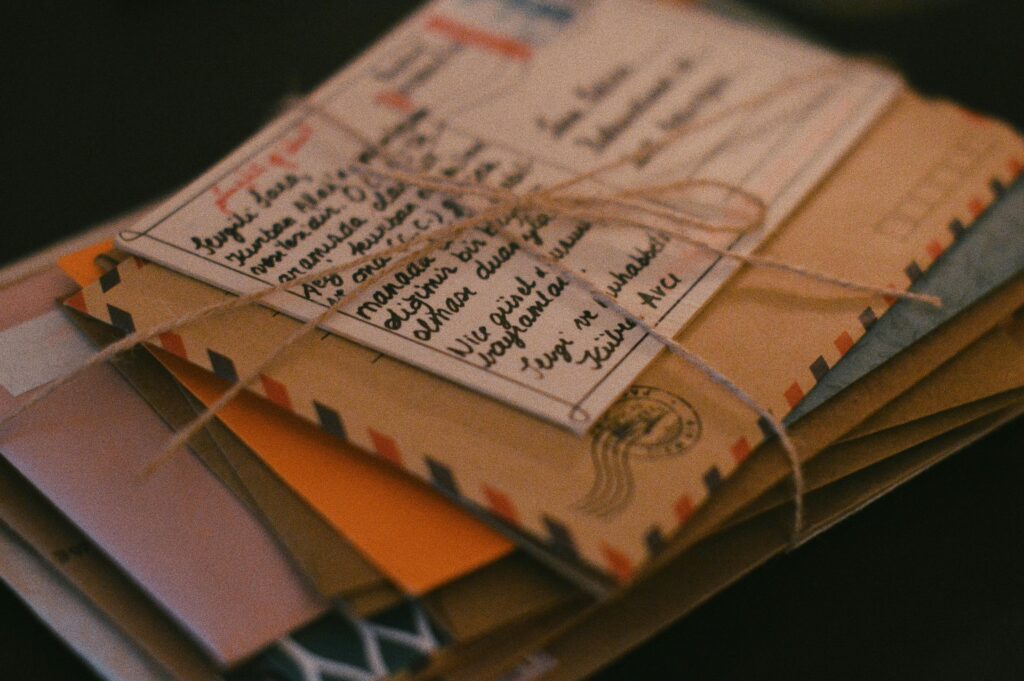 A stack of letters and postcards tied up with twine.